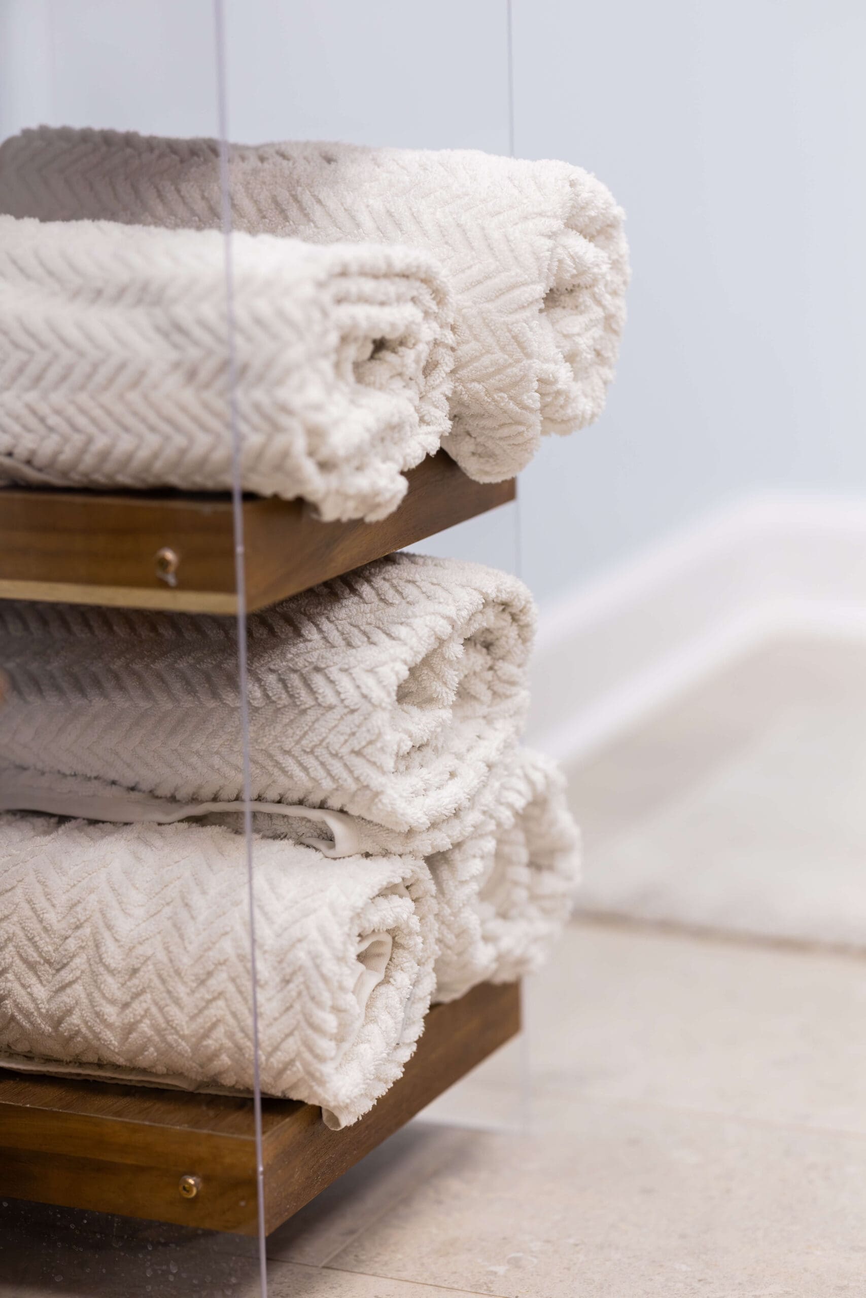 Details of rolled up towels on a shelf