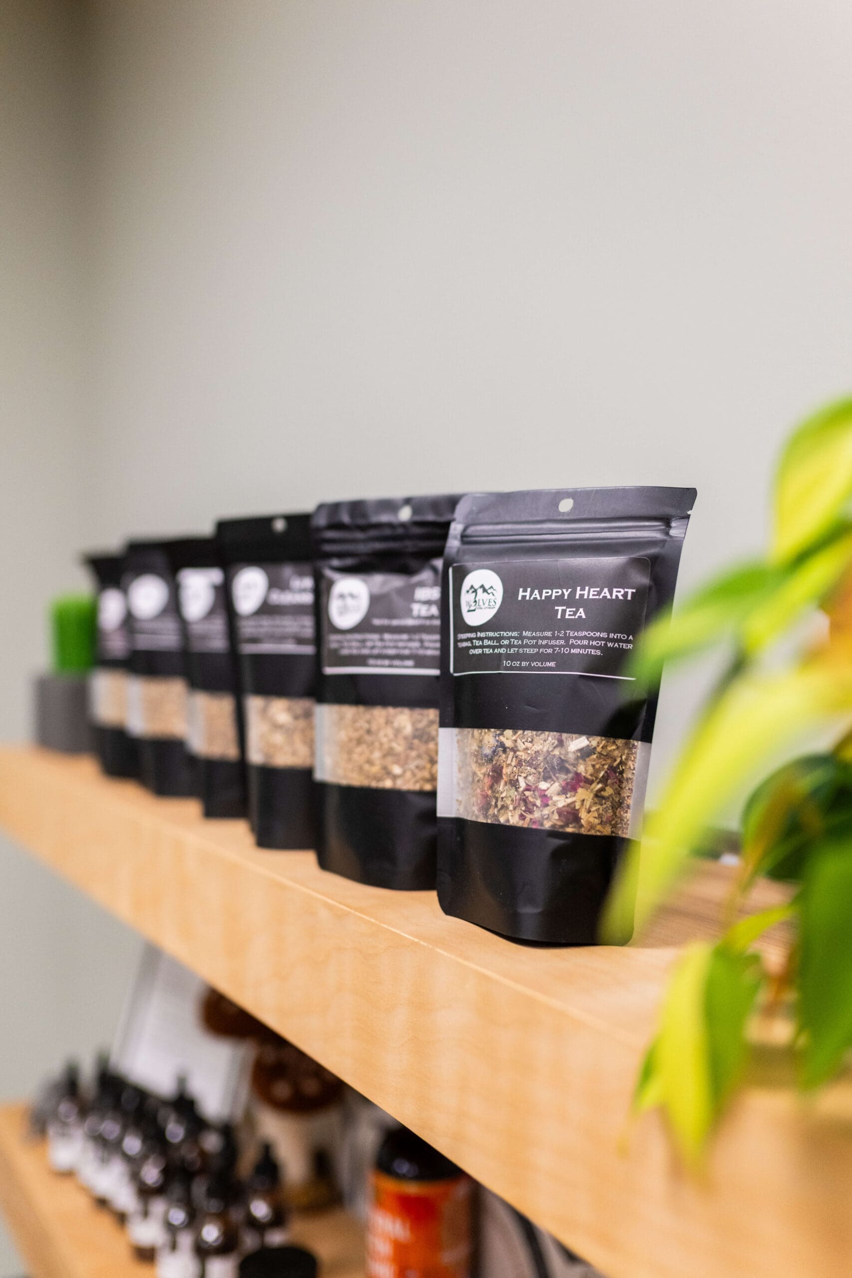 Details of a tea shelf in the shop of Compass Rose Health and Wellness