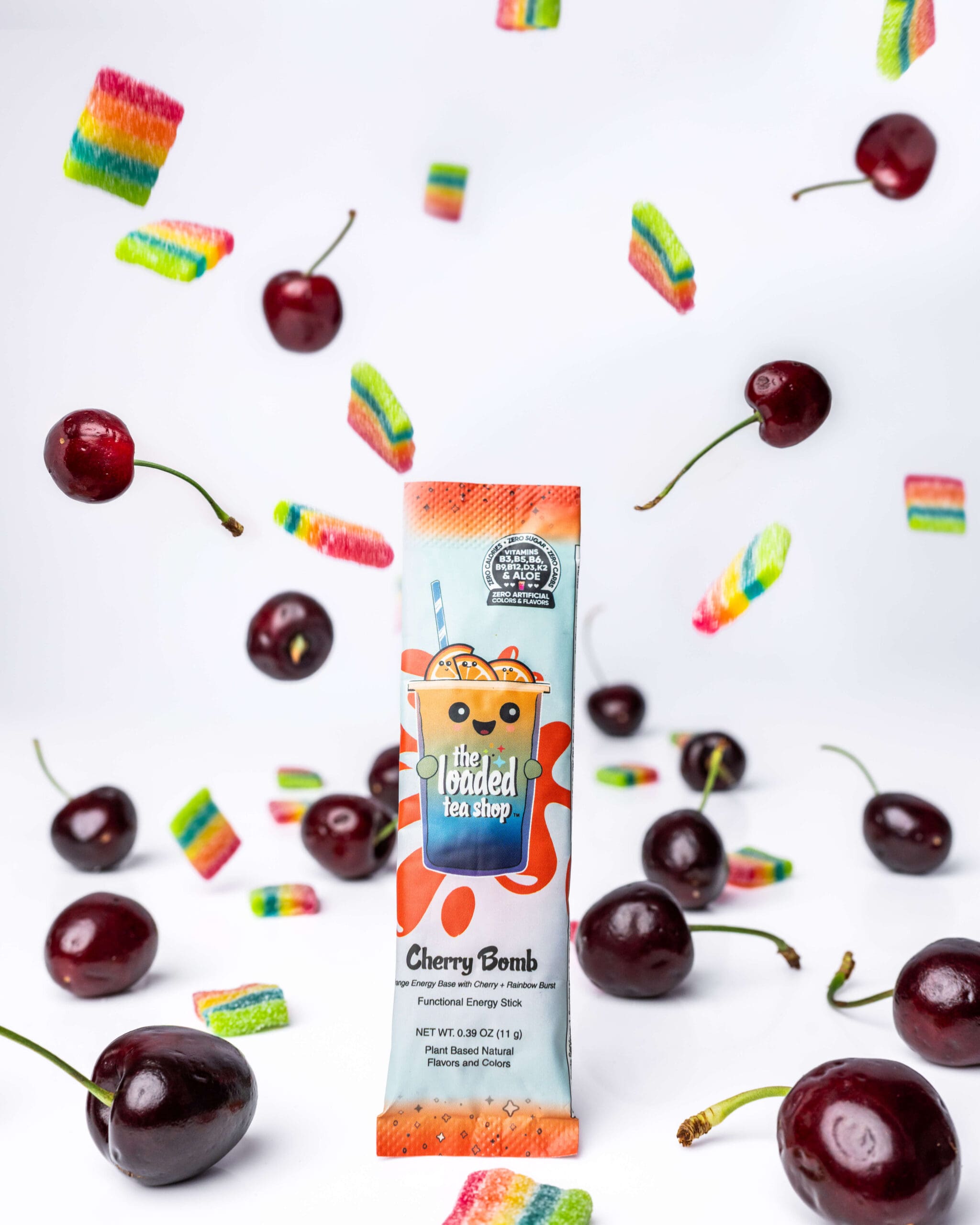 A drink powder pouch in a studio surrounded by falling cherries and rainbow candies thanks to professional product photography vs AI generated content